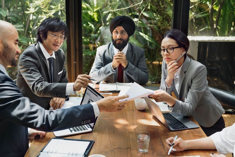 Consultants collaborating around a table
